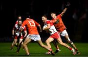 1 November 2020; Conor Glass of Derry in action against Niall Grimley of Armagh during the Ulster GAA Football Senior Championship Quarter-Final match between Derry and Armagh at Celtic Park in Derry. Photo by David Fitzgerald/Sportsfile