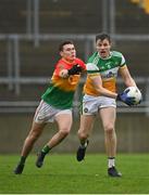1 November 2020; John Moloney of Offaly in action against Jordan Morrissey of Carlow during the Leinster GAA Football Senior Championship Round 1 match between Offaly and Carlow at Bord na Mona O'Connor Park in Tullamore, Offaly. Photo by Seb Daly/Sportsfile