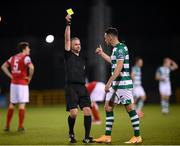 4 November 2020; Referee Sean Grant issues a yellow card to Aaron Greene of Shamrock Rovers for time wasting during the SSE Airtricity League Premier Division match between Shamrock Rovers and St Patrick's Athletic at Tallaght Stadium in Dublin. Photo by Stephen McCarthy/Sportsfile