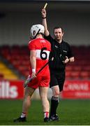 7 November 2020; Referee Colum Cunning shows a yellow card to Eamon McGill of Derry during the Christy Ring Cup Round 2B match between Derry and Offaly at Páirc Esler in Newry, Down. Photo by Sam Barnes/Sportsfile