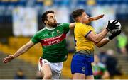 8 November 2020; Conor Cox of Roscommon in action against Chris Barrett of Mayo during the Connacht GAA Football Senior Championship Semi-Final match between Roscommon and Mayo at Dr Hyde Park in Roscommon. Photo by Harry Murphy/Sportsfile