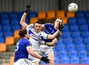 8 November 2020; Andrew Farrell of Longford with team-mate Patrick Fox in action against Gary Walsh of Laois during the Leinster GAA Football Senior Championship Quarter-Final match between Longford and Laois at Glennon Brothers Pearse Park in Longford. Photo by Ray McManus/Sportsfile