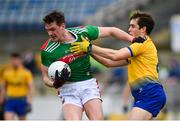 8 November 2020; Matthew Ruane of Mayo is tackled by David Murray of Roscommon during the Connacht GAA Football Senior Championship Semi-Final match between Roscommon and Mayo at Dr Hyde Park in Roscommon. Photo by Ramsey Cardy/Sportsfile