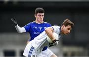 8 November 2020; Trevor Collins of Laois is tackled by Iarla O'Sullivan of Longford during the Leinster GAA Football Senior Championship Quarter-Final match between Longford and Laois at Glennon Brothers Pearse Park in Longford. Photo by Ray McManus/Sportsfile