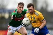 8 November 2020; Conor Devaney of Roscommon in action against Eoghan McLaughlin of Mayo during the Connacht GAA Football Senior Championship Semi-Final match between Roscommon and Mayo at Dr Hyde Park in Roscommon. Photo by Harry Murphy/Sportsfile