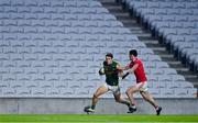 8 November 2020; David Clifford of Kerry in action against Maurice Shanley of Cork in front of empty stands during the Munster GAA Football Senior Championship Semi-Final match between Cork and Kerry at Páirc Uí Chaoimh in Cork. Photo by Brendan Moran/Sportsfile
