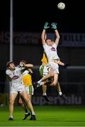 8 November 2020; Aaron Masterson of Kildare, supported by team-mate Kevin Feely, catches a kick-out ahead of Cathal Mangan and Jordan Hayes, right, of Offaly during the Leinster GAA Football Senior Championship Quarter-Final match between Offaly and Kildare at MW Hire O'Moore Park in Portlaoise, Laois. Photo by Piaras Ó Mídheach/Sportsfile