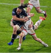 9 November 2020; TJ Ioane of Glasgow Warriors is tackled by Marcell Coetzee, left, and Michael Lowry of Ulster during the Guinness PRO14 match between Ulster and Glasgow Warriors at the Kingspan Stadium in Belfast. Photo by Ramsey Cardy/Sportsfile