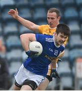 7 November 2020; Thomas Galligan of Cavan in action against Michael McCann of Antrim during the Ulster GAA Football Senior Championship Quarter-Final match between Cavan and Antrim at Kingspan Breffni in Cavan. Photo by Ramsey Cardy/Sportsfile