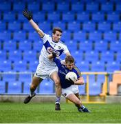 8 November 2020; Darragh Doherty of Longford is tackled by Trevor Collins of Laois, in front of an empty stand, during the Leinster GAA Football Senior Championship Quarter-Final match between Longford and Laois at Glennon Brothers Pearse Park in Longford. Photo by Ray McManus/Sportsfile
