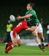 13 November 2020; James Lowe of Ireland is tackled by Leigh Halfpenny of Wales during the Autumn Nations Cup match between Ireland and Wales at Aviva Stadium in Dublin. Photo by Ramsey Cardy/Sportsfile