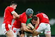 13 November 2020; Chris Farrell of Ireland is tackled by Owen Watkin, left, Jonathan Davies, centre, and Leigh Halfpenny of Wales during the Autumn Nations Cup match between Ireland and Wales at Aviva Stadium in Dublin. Photo by Ramsey Cardy/Sportsfile