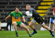 14 November 2020; Armagh goalkeeper Blaine Hughes in action against Jamie Brennan of Donegal during the Ulster GAA Football Senior Championship Semi-Final match between Donegal and Armagh at Kingspan Breffni in Cavan. Photo by Ramsey Cardy/Sportsfile