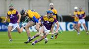 14 November 2020; Kevin Foley of Wexford in action against Colin Guilfoyle of Clare during the GAA Hurling All-Ireland Senior Championship Qualifier Round 2 match between Wexford and Clare at MW Hire O'Moore Park in Portlaoise, Laois. Photo by Matt Browne/Sportsfile