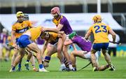 14 November 2020; Players contest the loose ball during the GAA Hurling All-Ireland Senior Championship Qualifier Round 2 match between Wexford and Clare at MW Hire O'Moore Park in Portlaoise, Laois. Photo by Piaras Ó Mídheach/Sportsfile