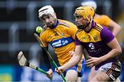 14 November 2020; Damien Reck of Wexford in action against Ryan Taylor of Clare during the GAA Hurling All-Ireland Senior Championship Qualifier Round 2 match between Wexford and Clare at MW Hire O'Moore Park in Portlaoise, Laois. Photo by Piaras Ó Mídheach/Sportsfile