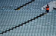 14 November 2020; Steward Colin Power stands watch in the empty stands during the GAA Hurling All-Ireland Senior Championship Qualifier Round 2 match between Cork and Tipperary at LIT Gaelic Grounds in Limerick. Photo by Brendan Moran/Sportsfile