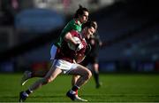 15 November 2020; Ian Burke of Galway in action against Oisin Mullin of Mayo during the Connacht GAA Football Senior Championship Final match between Galway and Mayo at Pearse Stadium in Galway. Photo by Ramsey Cardy/Sportsfile