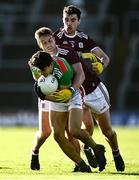 15 November 2020; Tommy Conroy of Mayo in action against Gary O'Donnell, centre, and Sean Mulkerry of Galway during the Connacht GAA Football Senior Championship Final match between Galway and Mayo at Pearse Stadium in Galway. Photo by David Fitzgerald/Sportsfile