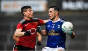 15 November 2020; Gerard Smith of Cavan in action against Daniel McGuinness of Down during the Ulster GAA Football Senior Championship Semi-Final match between Cavan and Down at Athletic Grounds in Armagh. PPhoto by Dáire Brennan/Sportsfile