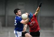 15 November 2020; Thomas Galligan of Cavan in action against Patrick Murdock of Down during the Ulster GAA Football Senior Championship Semi-Final match between Cavan and Down at Athletic Grounds in Armagh. Photo by Dáire Brennan/Sportsfile