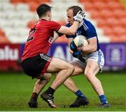 15 November 2020; Martin Reilly of Cavan in action against Peter Fegan of Down during the Ulster GAA Football Senior Championship Semi-Final match between Cavan and Down at Athletic Grounds in Armagh. Photo by Philip Fitzpatrick/Sportsfile