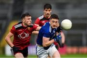 15 November 2020; Ciarán Brady of Cavan in action against Barry O’Hagan of Down during the Ulster GAA Football Senior Championship Semi-Final match between Cavan and Down at Athletic Grounds in Armagh. Photo by Philip Fitzpatrick/Sportsfile