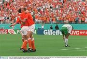 4 July 1994; Holland's Denis Bergkamp is congratulated by team-mate Marc Overmars on scoring their sides goal as Terry Phelan, (3) Republic of Ireland, looks on. FIFA World Cup Finals, Republic of Ireland v Holland, Orange Bowl, Orlando, Florida, USA. Picture credit; David Maher / SPORTSFILE