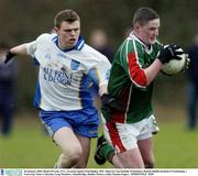 28 January 2004; Ruairi O'Loan, UUC, in action against Paul Begley, DIT. Sigerson Cup football, Preliminary Round, Dublin Institute of Technology v University Ulster Coleraine, Long Meadows, Islandbridge, Dublin. Picture credit; Damien Eagers / SPORTSFILE *EDI*