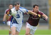 6 July 2013; Gary Hurney, Waterford, in action against Finian Hanley, Galway. GAA Football All-Ireland Senior Championship, Round 2, Galway v Waterford, Pearse Stadium, Salthill, Galway. Picture credit: Ray Ryan / SPORTSFILE