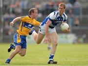 6 July 2013; Donal Kingston, Laois, in action against Declan Callinan, Clare. GAA Football All-Ireland Senior Championship, Round 2, Clare v Laois, Cusack Park, Ennis, Co. Clare. Picture credit: Diarmuid Greene / SPORTSFILE