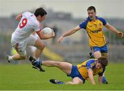 6 July 2013; Sean Cavanagh, Tyrone, is tackled by David Keenan and Niall Carty, 3, Roscommon. GAA Football All-Ireland Senior Championship, Round 2, Roscommon v Tyrone, Dr Hyde Park, Roscommon. Picture credit: Matt Browne / SPORTSFILE