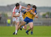 6 July 2013; Sean Cavanagh, Tyrone, is tackled by David Keenan and Niall Carty, Roscommon. GAA Football All-Ireland Senior Championship, Round 2, Roscommon v Tyrone, Dr Hyde Park, Roscommon. Picture credit: Matt Browne / SPORTSFILE