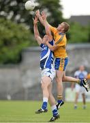 6 July 2013; John O'Loughlin, Laois, in action against Ger Quinlan, Clare. GAA Football All-Ireland Senior Championship, Round 2, Clare v Laois, Cusack Park, Ennis, Co. Clare. Picture credit: Diarmuid Greene / SPORTSFILE