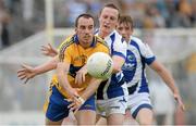 6 July 2013; Rory Donnelly, Clare, in action against Peter O'Leary, Laois. GAA Football All-Ireland Senior Championship, Round 2, Clare v Laois, Cusack Park, Ennis, Co. Clare. Picture credit: Diarmuid Greene / SPORTSFILE