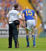 6 July 2013; Lar Corbett, Tipperary, holds his leg before leaving the pitch with a hamstring injury. GAA Hurling All-Ireland Senior Championship, Phase II, Kilkenny v Tipperary, Nowlan Park, Kilkenny. Picture credit: Brendan Moran / SPORTSFILE