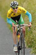 7 July 2013; Overall race leader Eddie Dunbar, Ireland - Stena Line, approaches the finish line on Gallows Hill to take victory on Stage 6 on the 2013 Junior Tour of Ireland, Ennis - Gallows Hill, Co. Clare. Picture credit: Stephen McMahon / SPORTSFILE