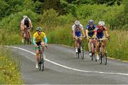 7 July 2013; Overall race leader Eddie Dunbar, Ireland - Stena Line, in yellow, at the front of the peloton on Stage 6 on the 2013 Junior Tour of Ireland, Ennis - Gallows Hill, Co. Clare. Picture credit: Stephen McMahon / SPORTSFILE