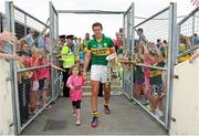 7 July 2013; Kerry captain Eoin Brosnan carries the trophy back to the dressing room with his daughter Annie, age 3, after the game. Munster GAA Football Senior Championship Final, Kerry v Cork, Fitzgerald Stadium, Killarney, Co. Kerry. Picture credit: Barry Cregg / SPORTSFILE