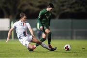 18 November 2020; Danny Mandroiu of Republic of Ireland in action against Mathias Olesen of Luxembourg during the UEFA European U21 Championship Qualifier match between Luxembourg and Republic of Ireland at Stade Henri-Dunant in Beggen, Luxembourg. Photo by Gerry Schmidt/Sportsfile