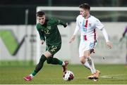 18 November 2020; Timothe Rupil of Luxembourg in action against Danny Grant of Republic of Ireland during the UEFA European U21 Championship Qualifier match between Luxembourg and Republic of Ireland at Stade Henri-Dunant in Beggen, Luxembourg. Photo by Gerry Schmidt/Sportsfile