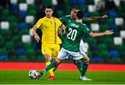 18 November 2020; Ionut Nedelcearu of Romania in action against Craig Cathcart and Josh Magennis of Northern Ireland during the UEFA Nations League B match between Northern Ireland and Romania at the National Football Stadium at Windsor Park in Belfast. Photo by David Fitzgerald/Sportsfile