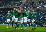 18 November 2020; Liam Boyce of Northern Ireland is congratulated by team-mates after scoring his side's first goal during the UEFA Nations League B match between Northern Ireland and Romania in the National Football Stadium at Windsor Park in Belfast. Photo by David Fitzgerald/Sportsfile