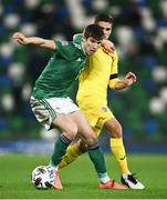 18 November 2020; Paddy McNair of Northern Ireland in action against Razvan Marin of Romania during the UEFA Nations League B match between Northern Ireland and Romania in the National Football Stadium at Windsor Park in Belfast. Photo by David Fitzgerald/Sportsfile
