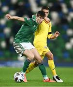 18 November 2020; Paddy McNair of Northern Ireland in action against Razvan Marin of Romania during the UEFA Nations League B match between Northern Ireland and Romania in the National Football Stadium at Windsor Park in Belfast. Photo by David Fitzgerald/Sportsfile