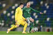 18 November 2020; Liam Boyce of Northern Ireland in action against Dennis Man of Romania during the UEFA Nations League B match between Northern Ireland and Romania in the National Football Stadium at Windsor Park in Belfast. Photo by David Fitzgerald/Sportsfile