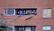 14 November 2020; Wexford supporters look on from an apartment near the pitch before the GAA Hurling All-Ireland Senior Championship Qualifier Round 2 match between Wexford and Clare at MW Hire O'Moore Park in Portlaoise, Laois. Photo by Piaras Ó Mídheach/Sportsfile