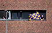 14 November 2020; A Wexford supporter looks on from an apartment near the pitch before the GAA Hurling All-Ireland Senior Championship Qualifier Round 2 match between Wexford and Clare at MW Hire O'Moore Park in Portlaoise, Laois. Photo by Piaras Ó Mídheach/Sportsfile