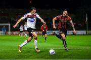 20 November 2020; David McMillan of Dundalk in action against Rob Cornwall of Bohemians during the Extra.ie FAI Cup Quarter-Final match between Bohemians and Dundalk at Dalymount Park in Dublin. Photo by Stephen McCarthy/Sportsfile