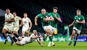 21 November 2020; Jacob Stockdale of Ireland beats the tackle of Dan Robson of England on the way to scoring his side's first try during the Autumn Nations Cup match between England and Ireland at Twickenham Stadium in London, England. Photo by Matt Impey/Sportsfile